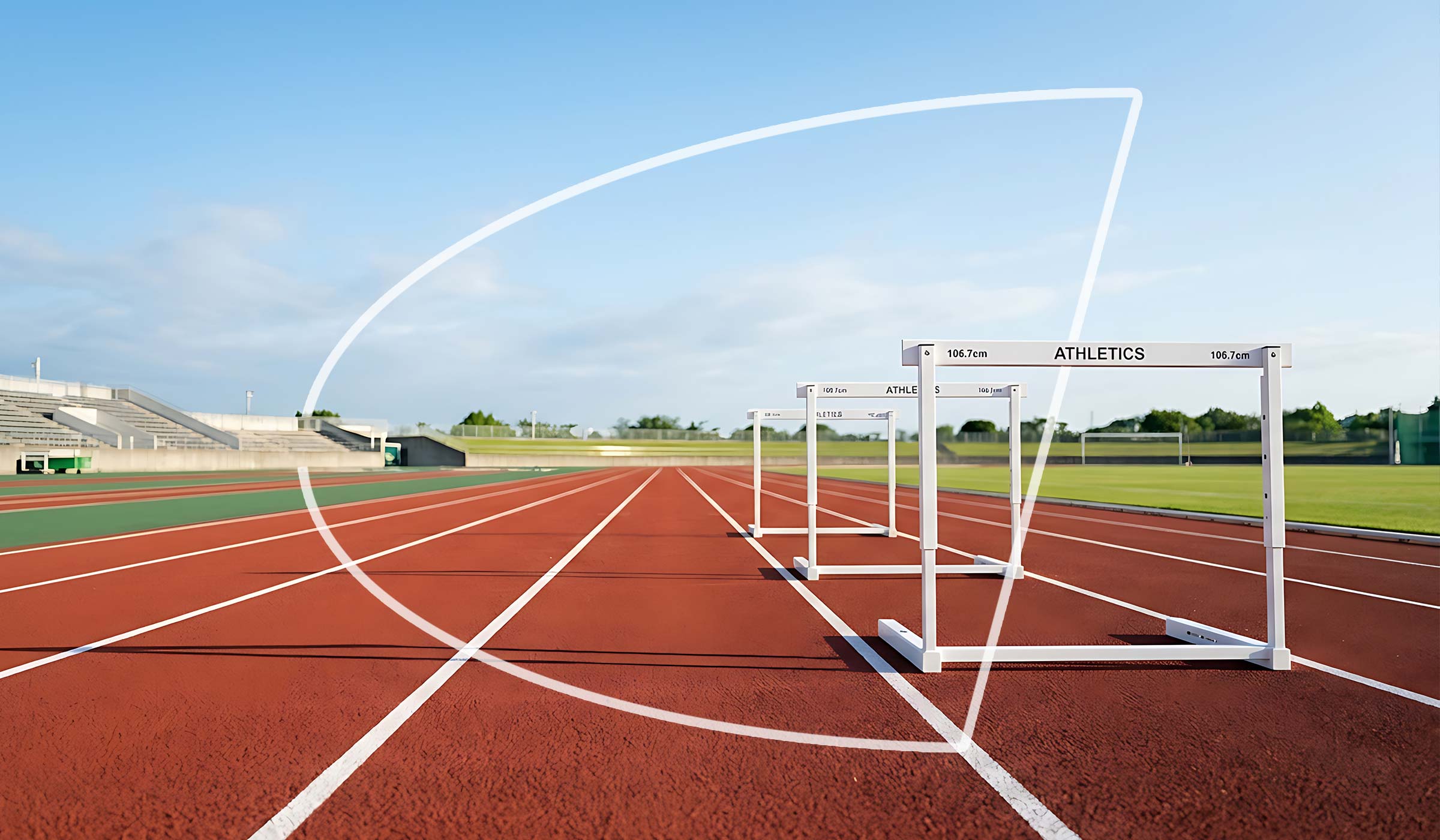 Hurdles on a red athletics track in an outdoor stadium